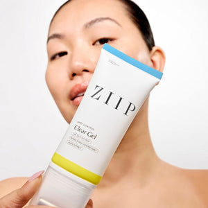 Woman holding the ZIIP Clear Gel
